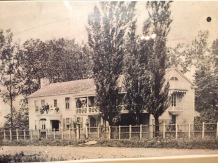 An early photo of the Scholte's house. It was the first house built in Pella and now stands as a museum on the north side of the square.