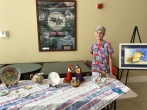 Grandma Jeanne showing off her artwork at their community.