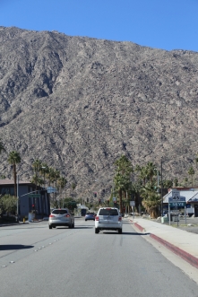 Mountains loom over Palm Springs like a giant wall.